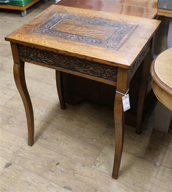 A carved oak table W.61cm